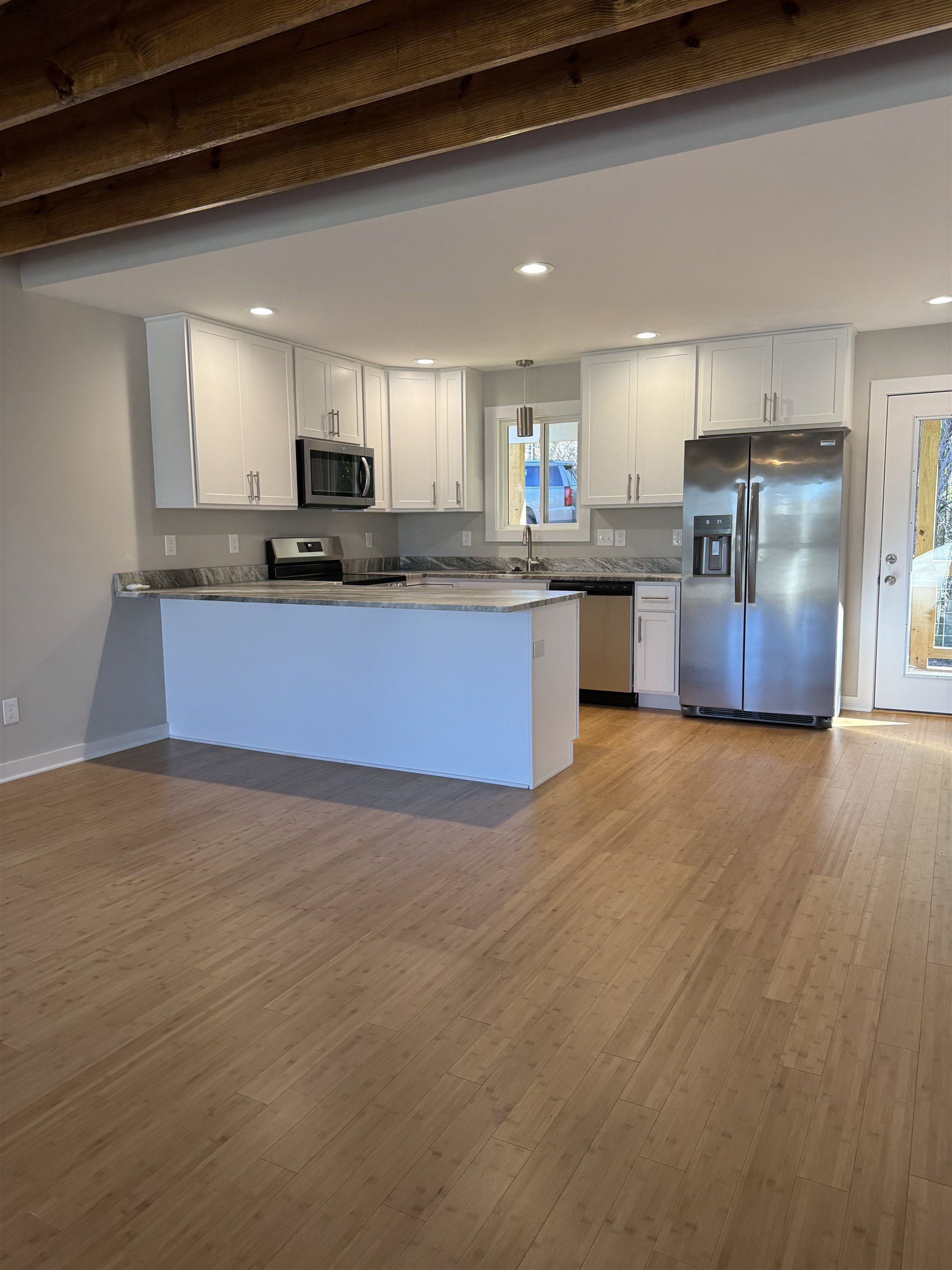 Master on Main 3 Bed — kitchen with white shaker cabinets and stainless appliances