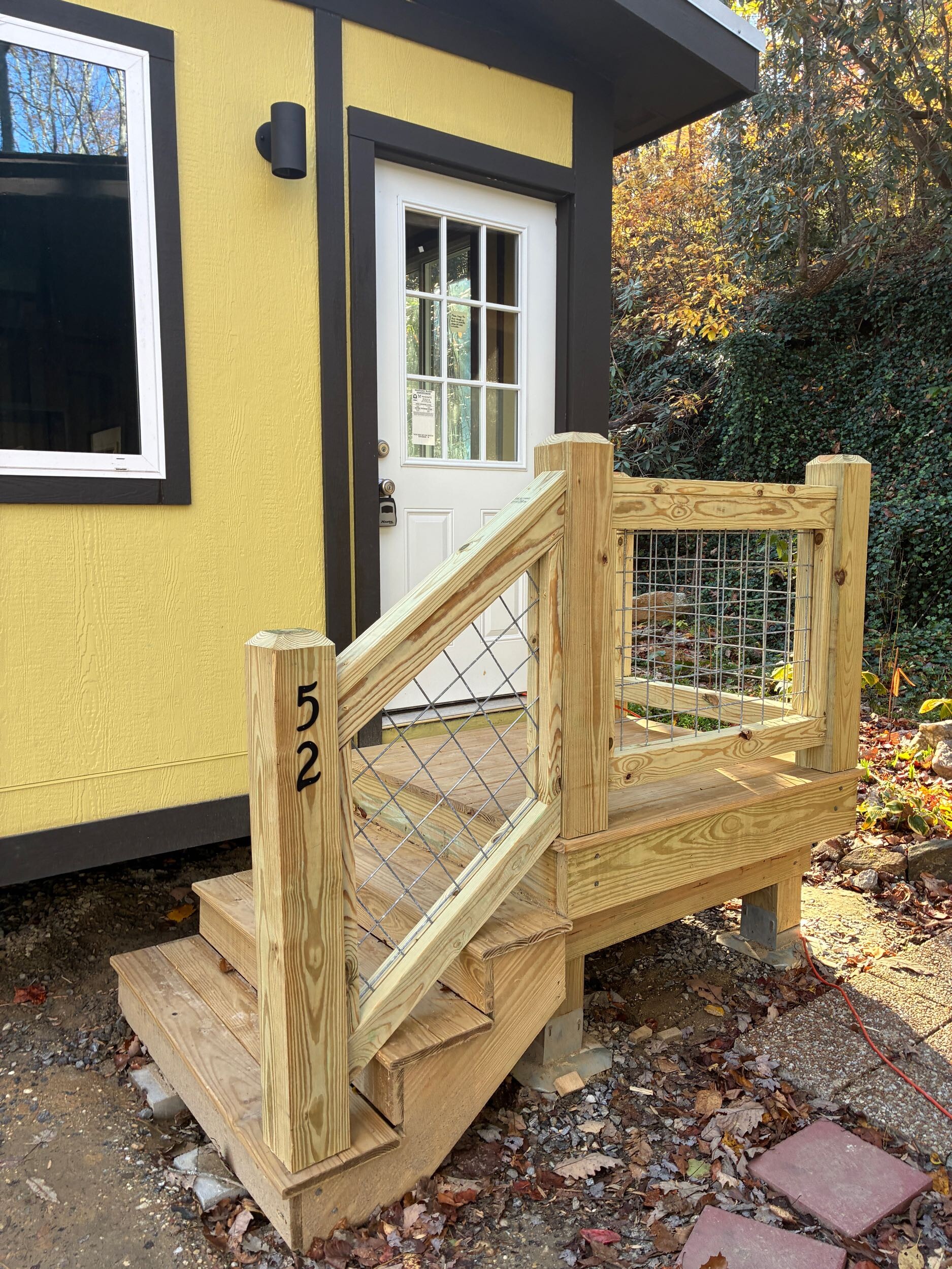 Origami Home exterior — yellow unit at Amble