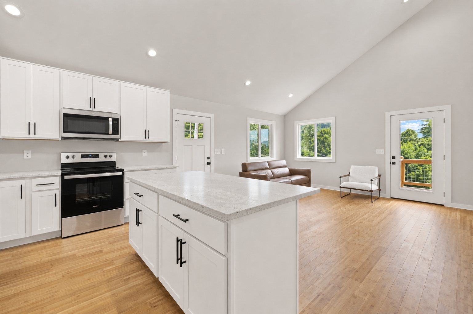 Single Level Cottage 2 Bed — kitchen island open to living room