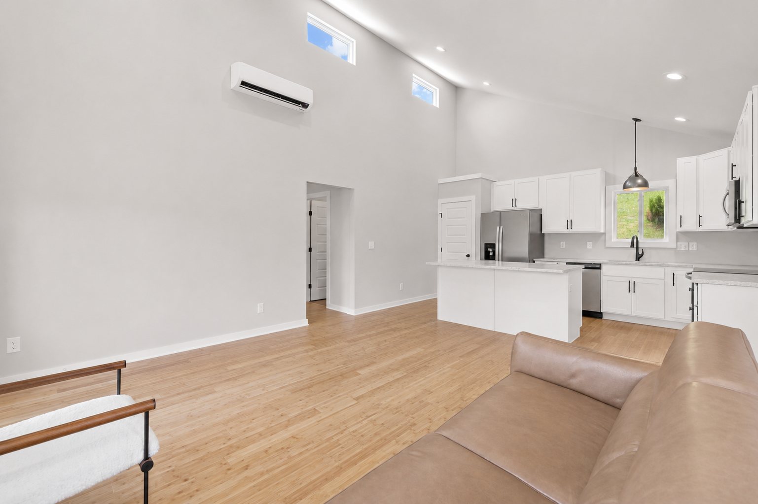 Single Level Cottage 2 Bed — open living room and kitchen with vaulted ceiling